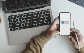 Image of a someone holding their cell phone with the APOSW app displayed.