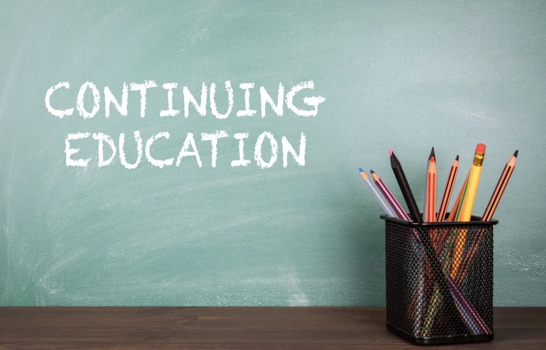 Chalkboard with continuing education written on it. 